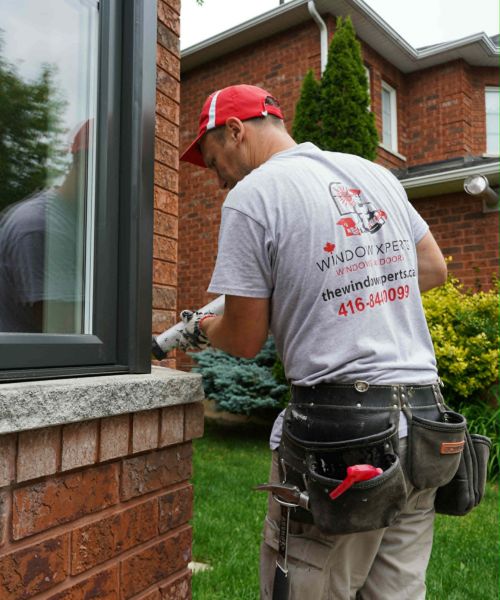 Installation crew finishing a window exterior in the King City area