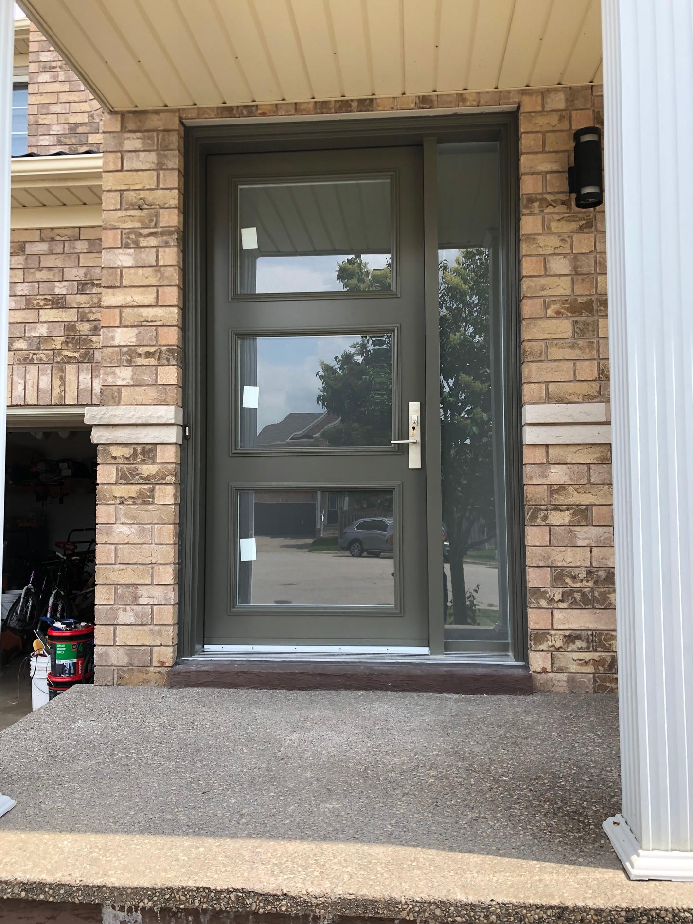 Modern front door with a brick entrance and stoop