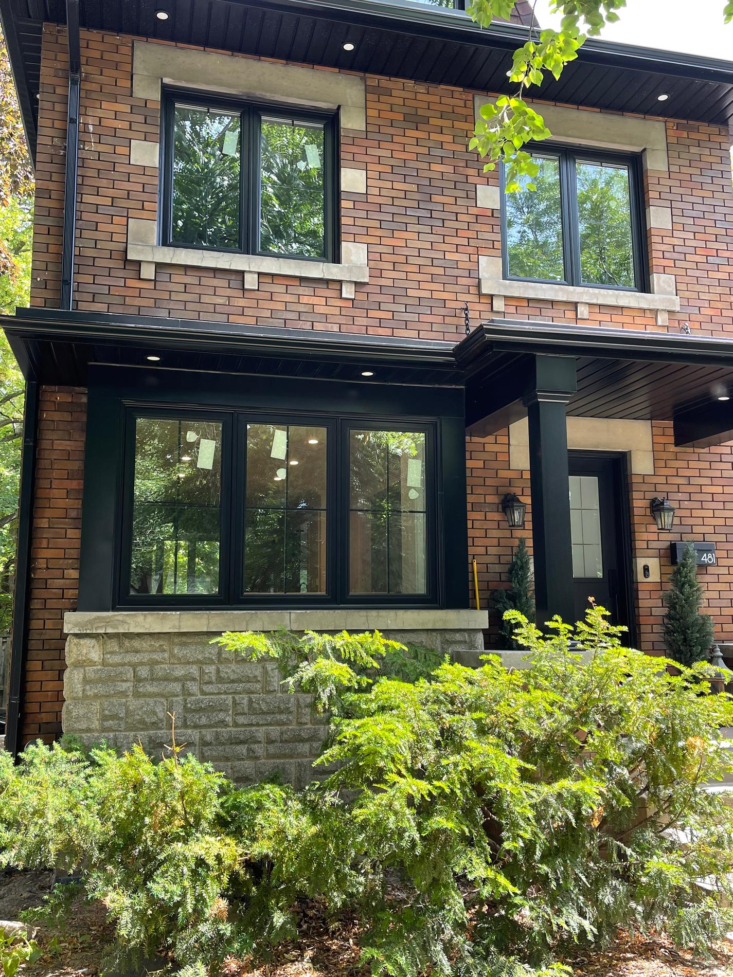 Modern house exterior with floor-to-ceiling windows