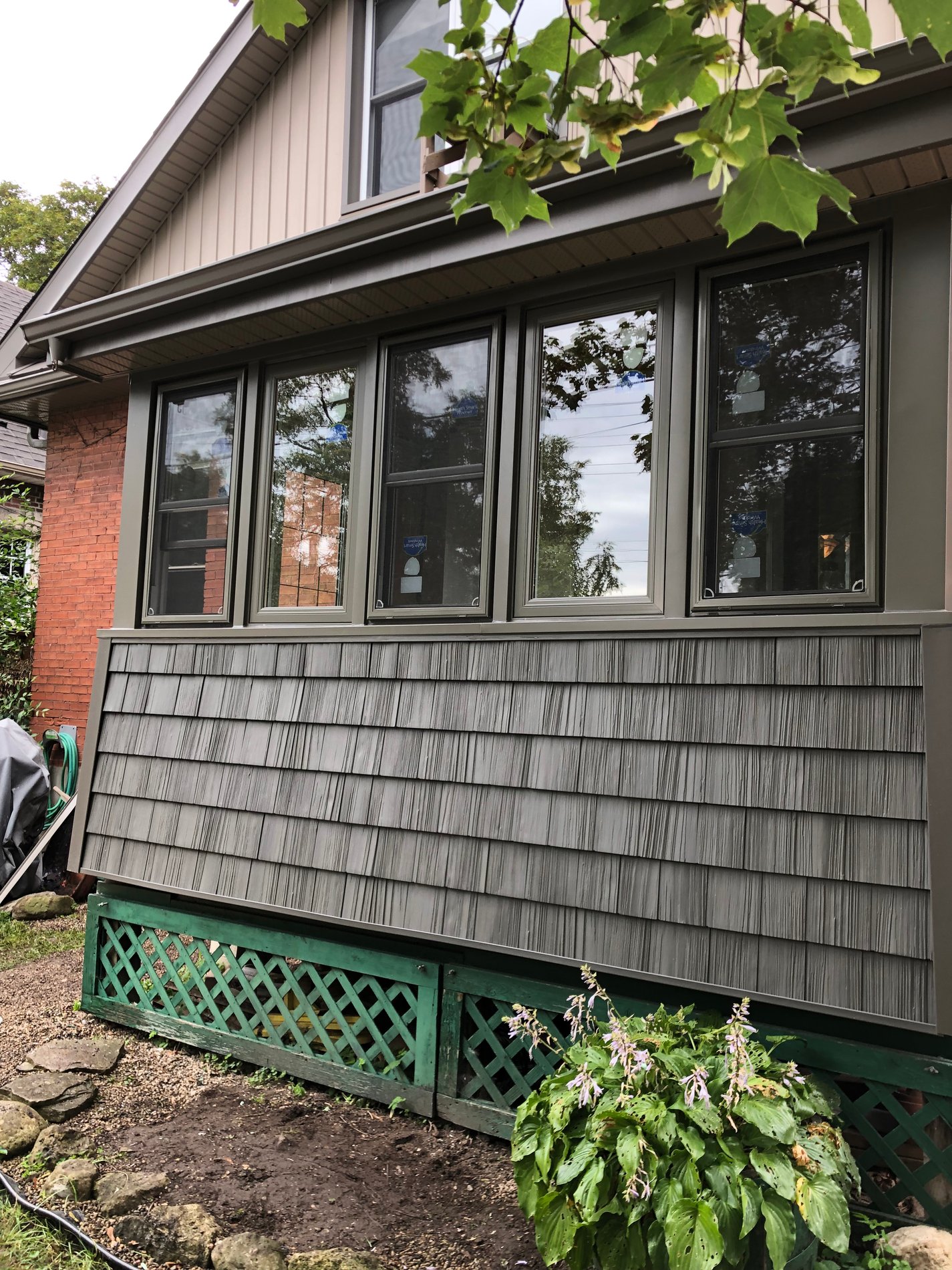 Newly finished house exterior with fresh siding and windows