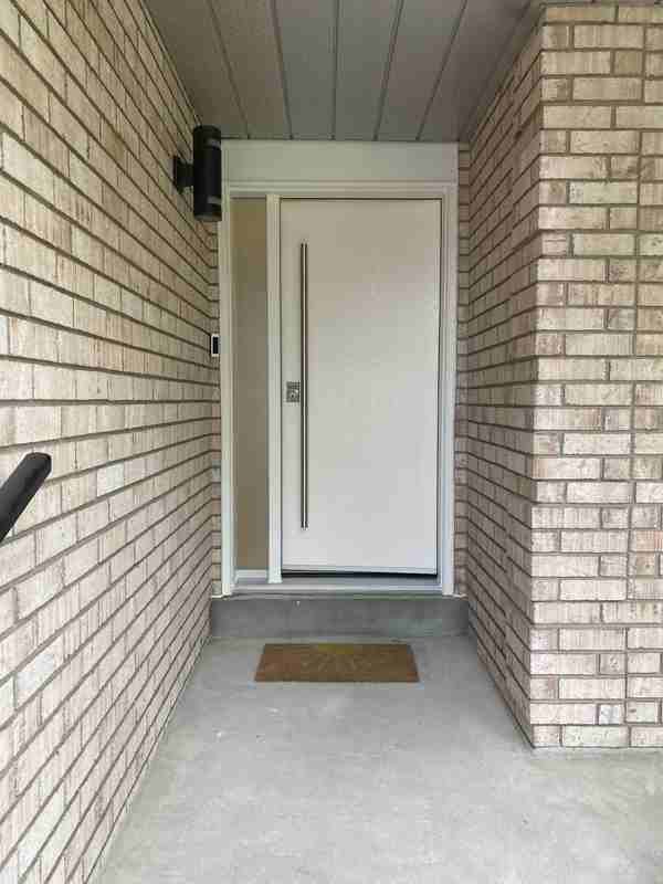 White entry door with frosted sidelight and long handle White entry door with frosted sidelight and long handle