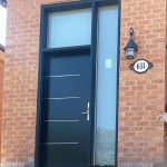 Black front door with tall side window and top window