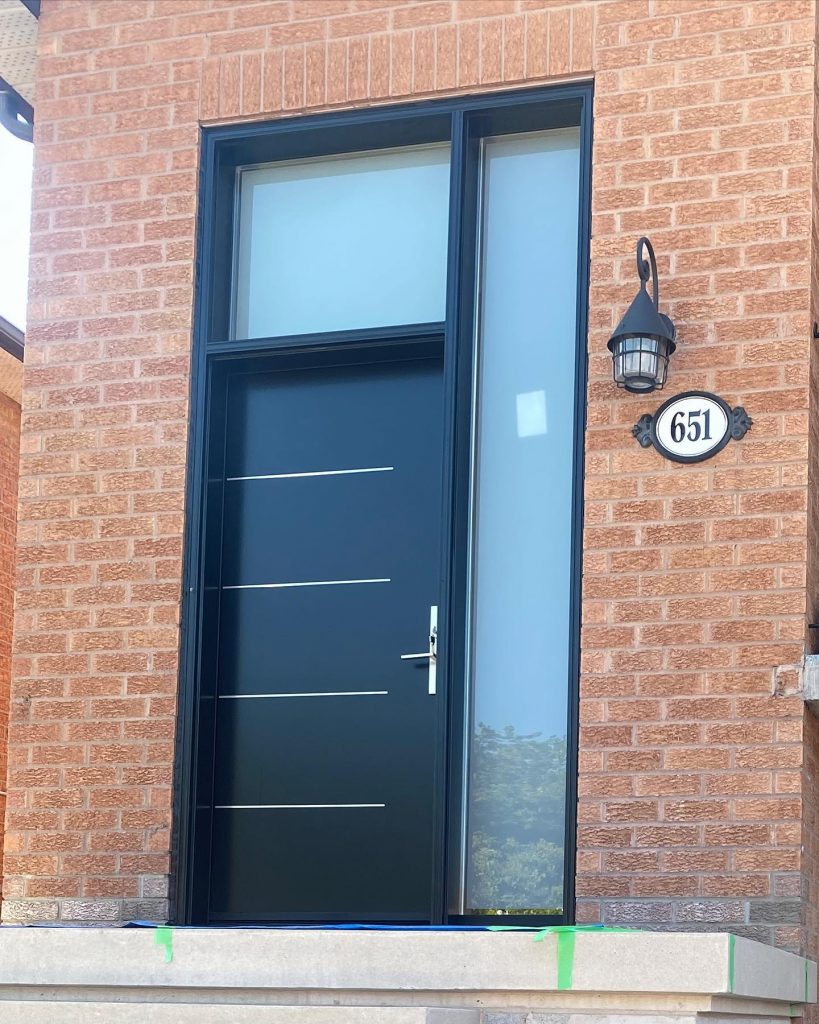 Black front door with tall side window and top window